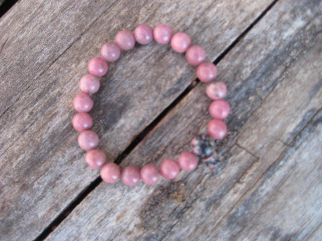 Rhodonite Discovering and developing hidden talents,compassion,love,generosity, altruism 1994